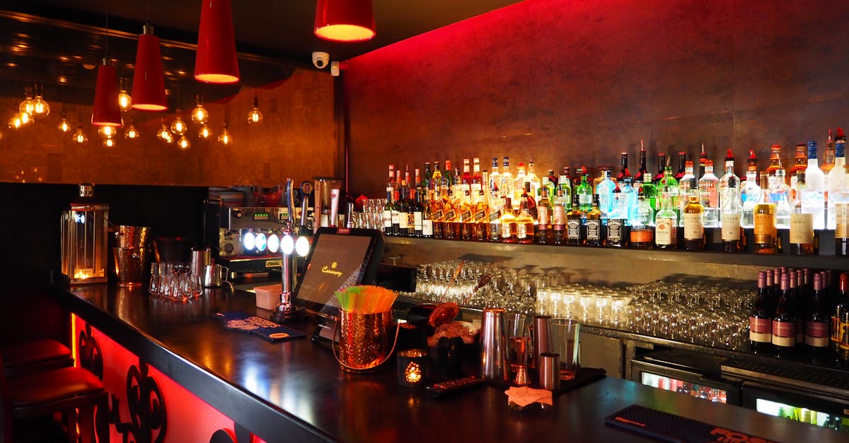 Enjoy the warm ambiance of a well-stocked, illuminated bar perfect for nightlife and celebrations.